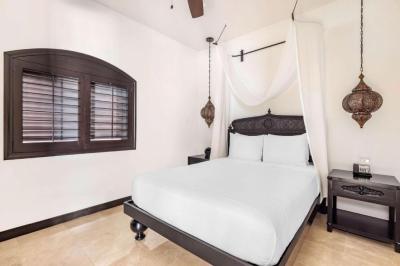 Deluxe Two Bedroom with One King and One Queen Beds - Pool View 2
