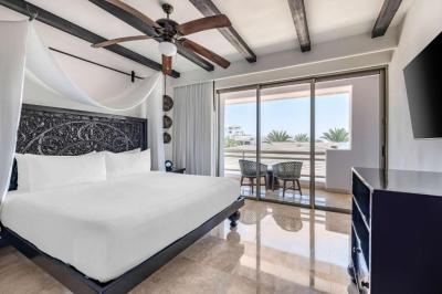 One Bedroom King Room with Partial Pool View and Balcony 14