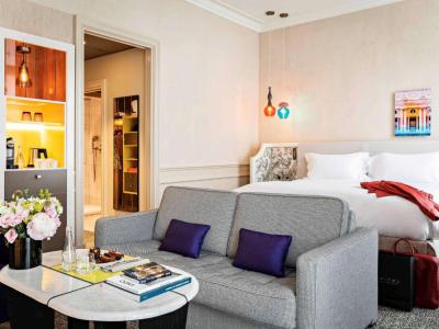 Junior King Suite with One King Bed/One Sofa Bed and Living Room - Courtyard or Rue Scribe View 1